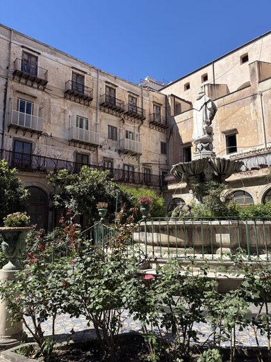 Palermo, Italy, a courtyard in the old town · June 2026