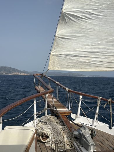 Porto Zafferano, Sardinia, under sail · August 2026